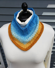 Load image into Gallery viewer, Cowl with eyelets in a gradient yarn from Blue at top to lighter blues then yellows and orange at bottom.