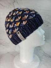 Load image into Gallery viewer, Navy blue lotus flower beanie with yellow, orange, white and blue multicolor flowers. No pom.