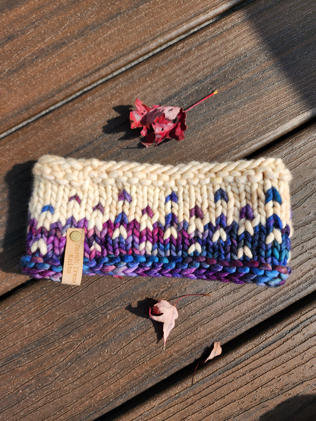 Headband in ivory and blue purple multicolor pattern.