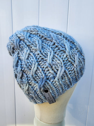 Braided effect beanie in light blue color. No pom.