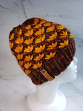 Load image into Gallery viewer, Lotus flower beanie in brown with orange flowers. No pom.
