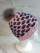 Load image into Gallery viewer, Lotus Flower beanie in pink with dark purple flowers. Grey faux fur pom on top.
