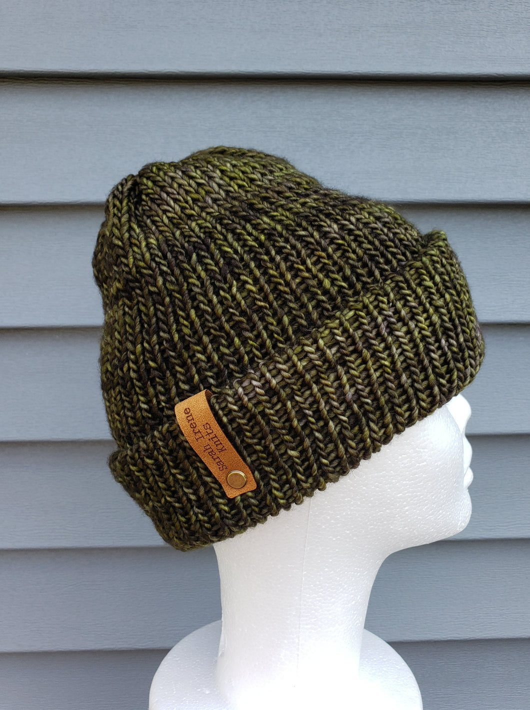 Double brim beanie in shades of green. No pom.