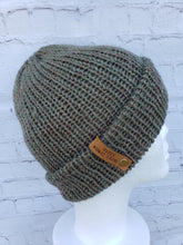 Load image into Gallery viewer, Double brim beanie in light green with speckles of tan and red. No pom.
