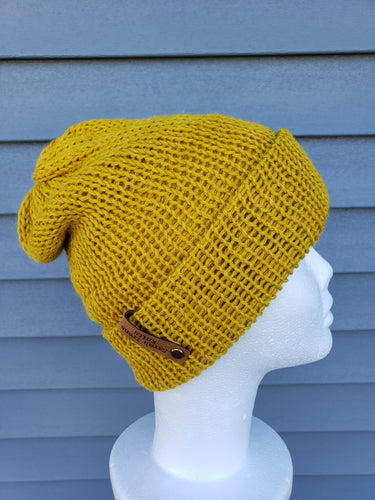 Double-brim beanie in mustard yellow color. No pom.