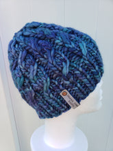 Load image into Gallery viewer, Cable effect beanie in multicolor blue and teal yarn. No pom.
