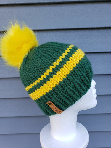 Classic green beanie with yellow stripes. Topped with a yellow faux fur pom.