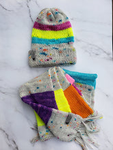 Load image into Gallery viewer, Knit scarf and hat in rainbow neon blocks of color alongside speckled blocks of color.
