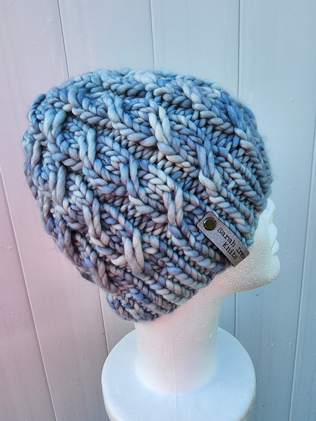 Braided effect beanie in light blue colored yarn. No pom.