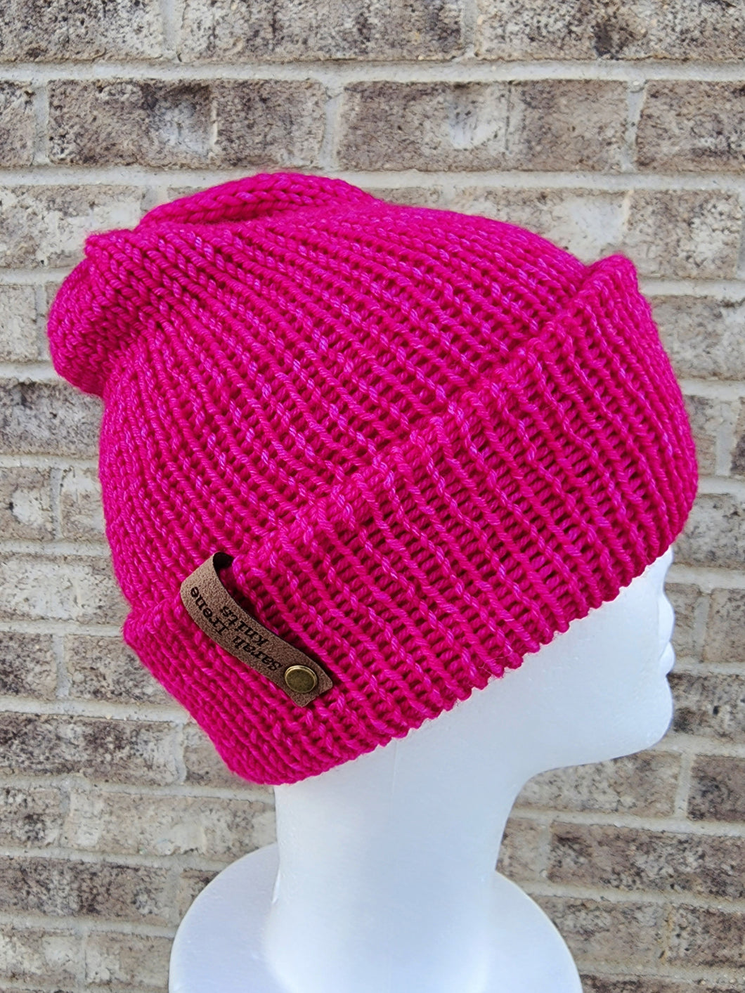 Double brim classic beanie in bright pink color. No pom.