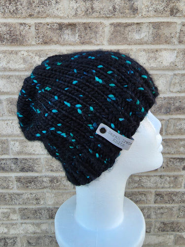 Classic beanie in black with teal speckles. No pom.
