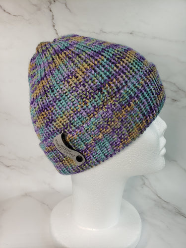 Double brim beanie in variegated purple, teal and yellow yarn. No pom.