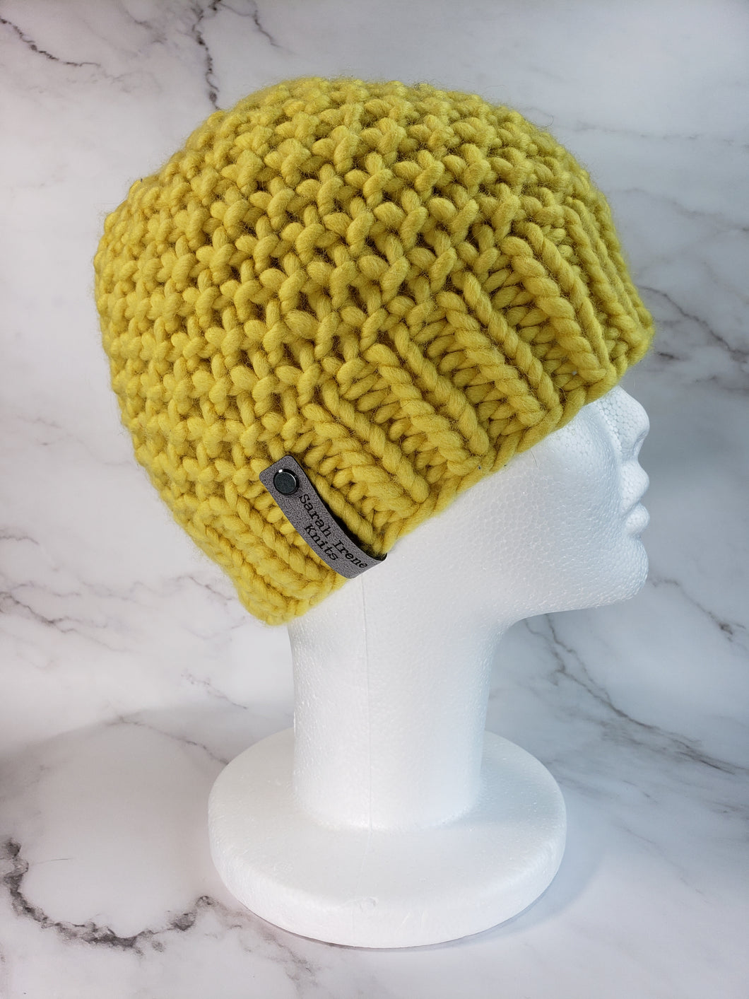 Textured beanie in yellow. No pom.